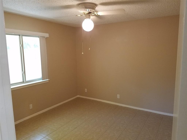 3513 Westchester Ave, Austin, TX 78759 - unfurnished room with a ceiling fan, a textured ceiling, and baseboards