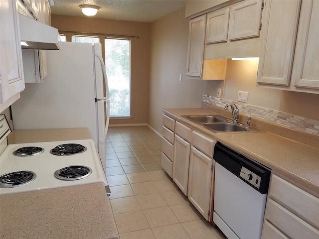 3513 Westchester Ave, Austin, TX 78759 - kitchen featuring white appliances, light tile patterned floors, under cabinet range hood, and light countertops