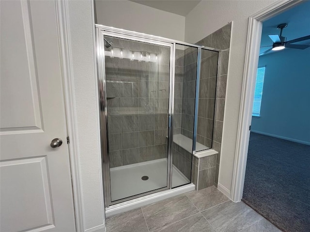 8525 Wellspring Loop, Round Rock, TX 78665 - bathroom featuring a stall shower, ceiling fan, and tile patterned floors