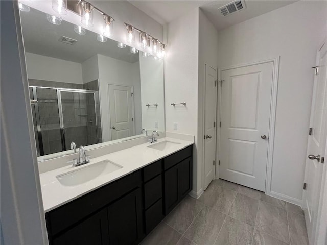 8525 Wellspring Loop, Round Rock, TX 78665 - bathroom featuring double vanity and a shower stall