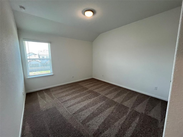 8525 Wellspring Loop, Round Rock, TX 78665 - carpeted empty room with vaulted ceiling and a smoke detector