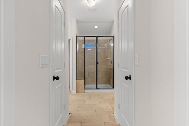 hallway featuring tile patterned flooring, recessed lighting, and baseboards