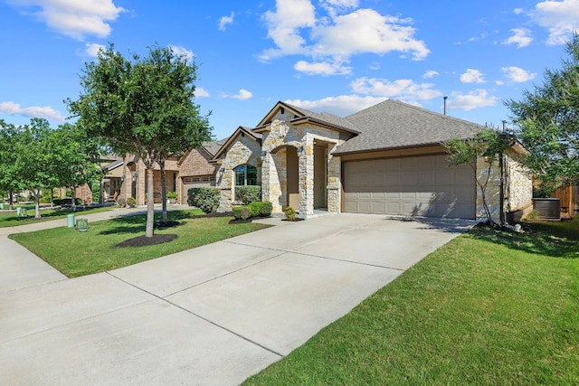 french provincial home featuring an attached garage, stone siding, a front lawn, concrete driveway, and cooling unit