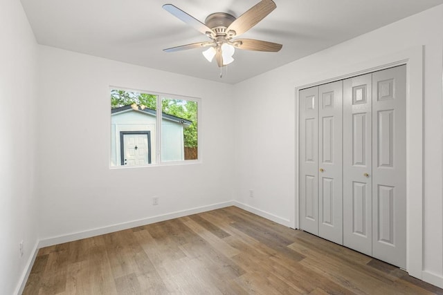 2506 Carlow Dr, Austin, TX 78745 - unfurnished bedroom featuring wood finished floors, baseboards, a closet, and a ceiling fan