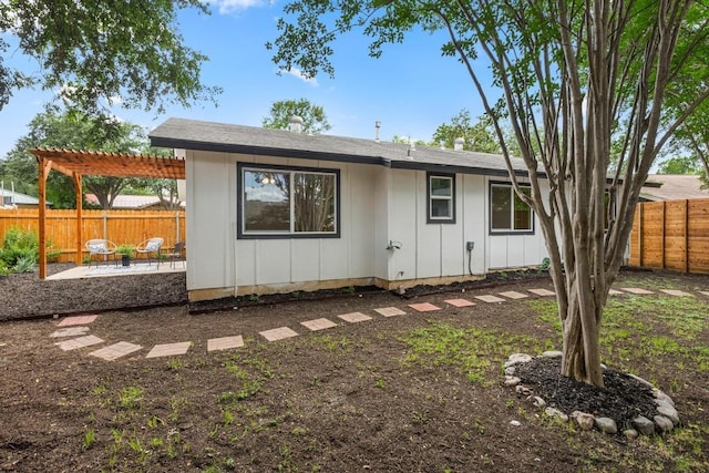 2506 Carlow Dr, Austin, TX 78745 - rear view of house with a pergola, a patio area, board and batten siding, and a fenced backyard