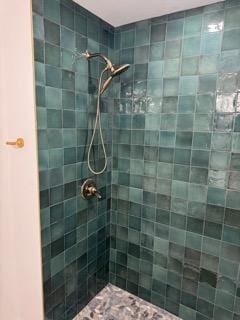 full bathroom with a tile shower