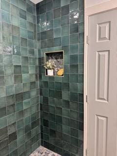 full bathroom with tiled shower