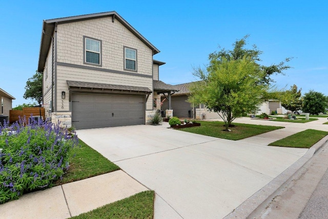 view of front of house featuring a garage, driveway, and stone siding