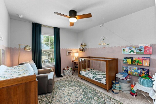 carpeted bedroom featuring a ceiling fan