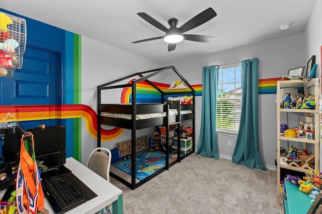 carpeted bedroom with a ceiling fan and baseboards