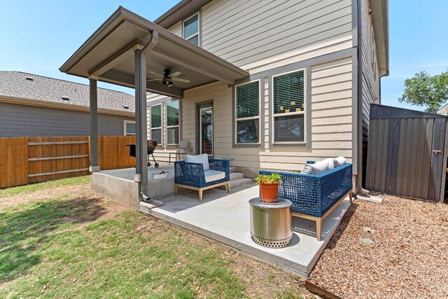 view of patio / terrace with a fenced backyard, a ceiling fan, and an outdoor hangout area