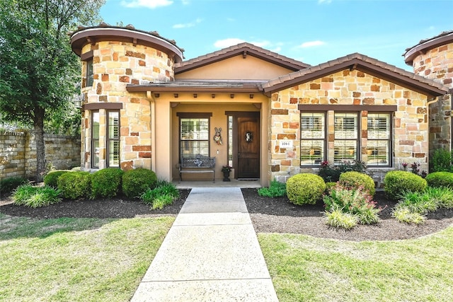 104 Rivalto Cir Unit 1, Lakeway, TX 78734 - doorway to property featuring stone siding, a chimney, and stucco siding