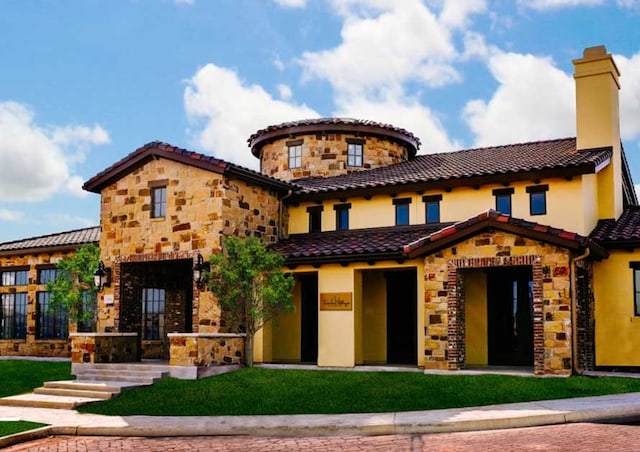104 Rivalto Cir Unit 1, Lakeway, TX 78734 - mediterranean / spanish-style house with stone siding, stucco siding, and a tile roof
