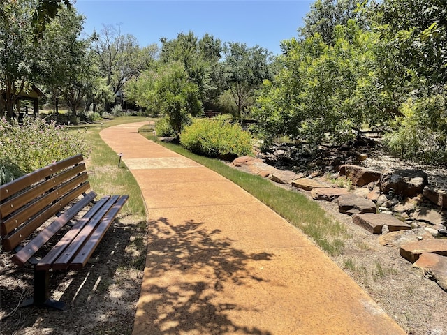 104 Rivalto Cir Unit 1, Lakeway, TX 78734 - surrounding community featuring view of wooded area