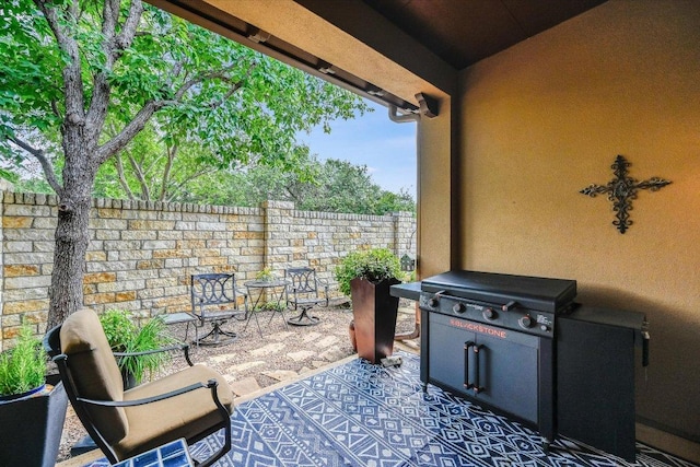 104 Rivalto Cir Unit 1, Lakeway, TX 78734 - fenced backyard with a patio and a grill