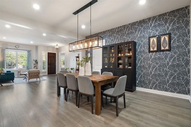 225 Escarpment Way, Cedar Park, TX 78613 - dining room featuring wallpapered walls, an accent wall, recessed lighting, baseboards, and light wood-type flooring