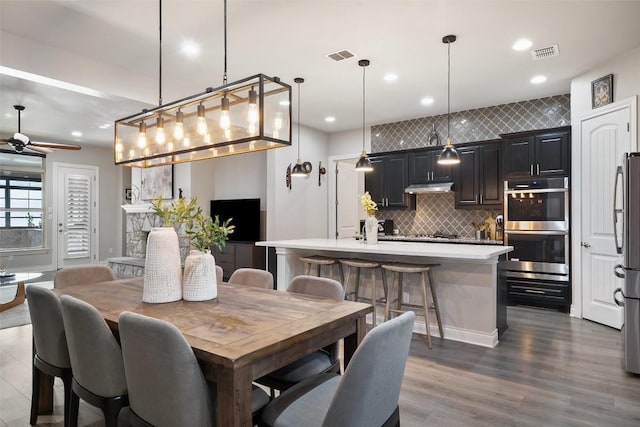 225 Escarpment Way, Cedar Park, TX 78613 - dining space with ceiling fan, dark wood-type flooring, and recessed lighting