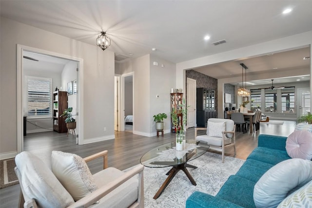 225 Escarpment Way, Cedar Park, TX 78613 - living area featuring a chandelier, wood finished floors, baseboards, and recessed lighting