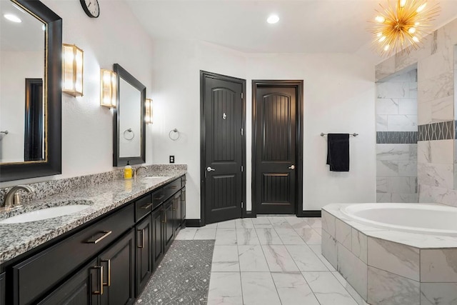 225 Escarpment Way, Cedar Park, TX 78613 - full bathroom featuring marble finish floors, a garden tub, baseboards, double vanity, and recessed lighting