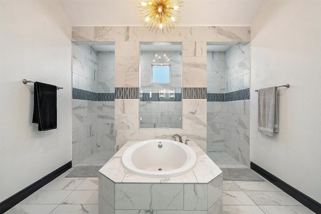 225 Escarpment Way, Cedar Park, TX 78613 - bathroom featuring baseboards, a garden tub, and marble look tile flooring