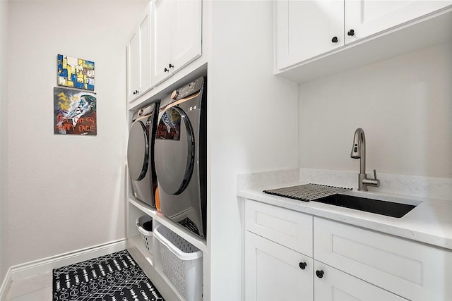 225 Escarpment Way, Cedar Park, TX 78613 - clothes washing area with cabinet space, baseboards, washing machine and clothes dryer, and tile patterned floors