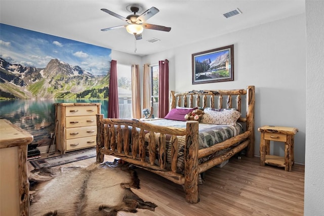 3908 Whitey Ford Way, Round Rock, TX 78665 - bedroom with light wood finished floors and a ceiling fan