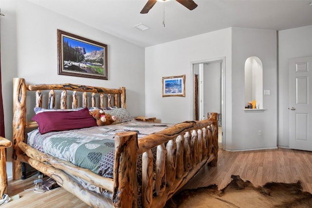 bedroom with wood finished floors and a ceiling fan