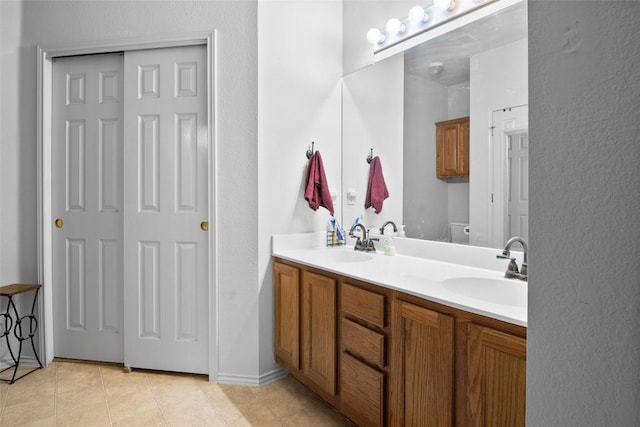 3908 Whitey Ford Way, Round Rock, TX 78665 - bathroom featuring double vanity and tile patterned flooring