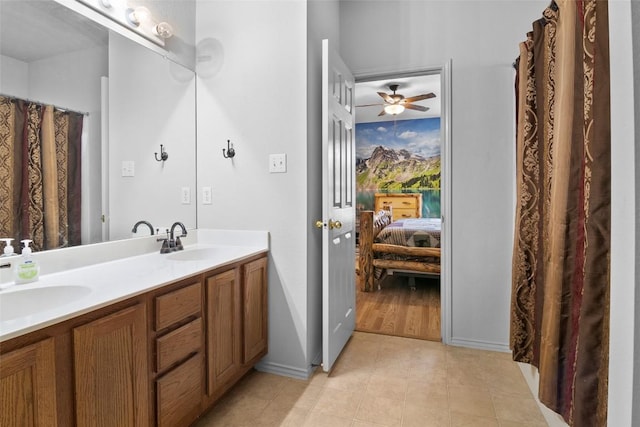 3908 Whitey Ford Way, Round Rock, TX 78665 - ensuite bathroom with double vanity, ceiling fan, and tile patterned floors