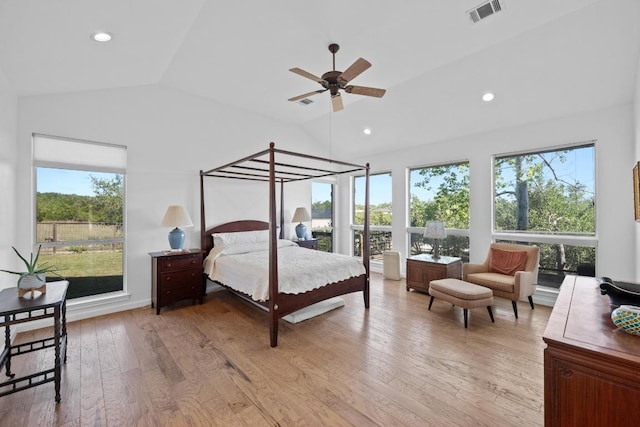 10978 W Cave Blvd, Dripping Springs, TX 78620 - bedroom featuring lofted ceiling, multiple windows, light wood-type flooring, and recessed lighting