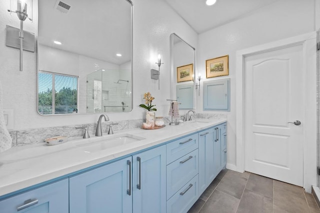 10978 W Cave Blvd, Dripping Springs, TX 78620 - full bath featuring a stall shower, double vanity, and recessed lighting