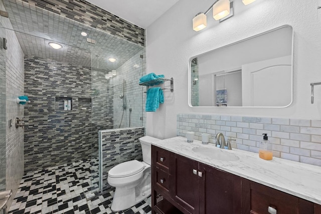 10978 W Cave Blvd, Dripping Springs, TX 78620 - bathroom featuring toilet, a shower stall, backsplash, and vanity