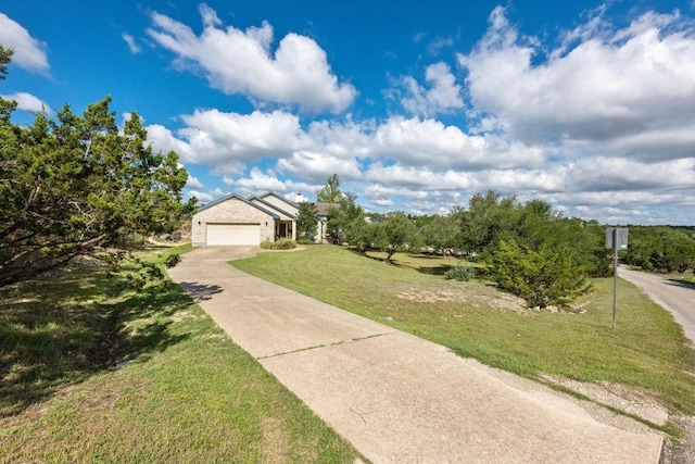 10978 W Cave Blvd, Dripping Springs, TX 78620 - view of front facade with driveway, a front yard, and a garage