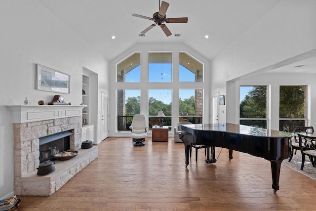 10978 W Cave Blvd, Dripping Springs, TX 78620 - sitting room featuring built in features, ceiling fan, hardwood / wood-style flooring, a fireplace, and recessed lighting