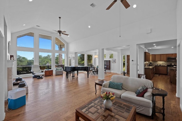 10978 W Cave Blvd, Dripping Springs, TX 78620 - living room with ceiling fan, high vaulted ceiling, recessed lighting, and light wood-style flooring