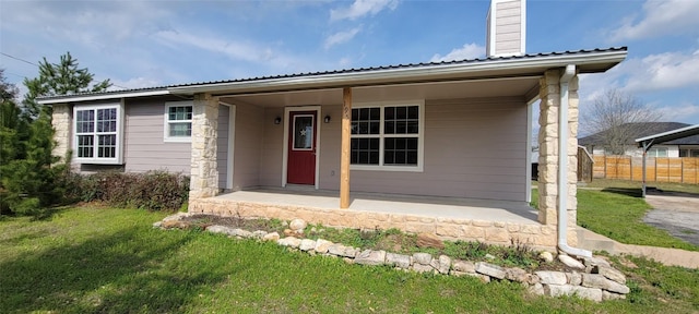 195 Cardinal Dr, Paige, TX 78659 - view of front of house with metal roof and a chimney