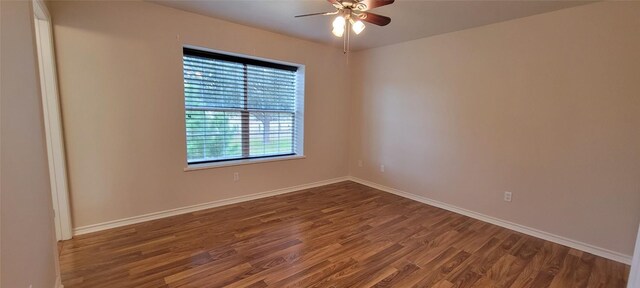 195 Cardinal Dr, Paige, TX 78659 - spare room with wood finished floors, ceiling fan, and baseboards