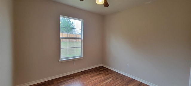 195 Cardinal Dr, Paige, TX 78659 - spare room featuring plenty of natural light, dark wood-style floors, baseboards, and ceiling fan