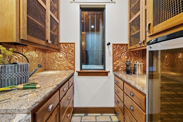 bar featuring tasteful backsplash, wall oven, and baseboards