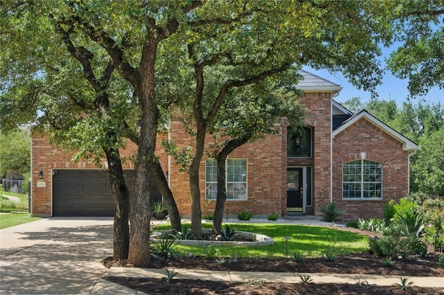 10725 Maelin Dr, Austin, TX 78739 - view of front of property with a garage, concrete driveway, brick siding, and a front yard