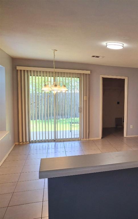 908 Sally Lunn Way, Pflugerville, TX 78660 - unfurnished dining area with tile patterned floors
