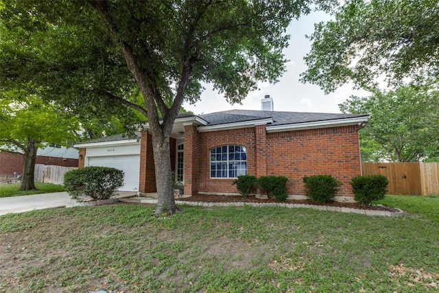 6614 Bramber Ln, Austin, TX 78754 - view of front facade with a garage, a chimney, brick siding, concrete driveway, and roof with shingles