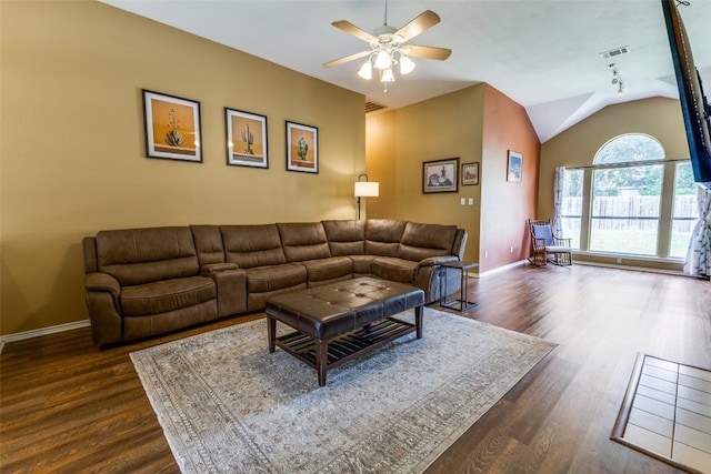 6614 Bramber Ln, Austin, TX 78754 - living area with ceiling fan, dark wood finished floors, baseboards, and lofted ceiling