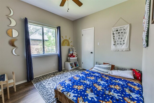 6614 Bramber Ln, Austin, TX 78754 - bedroom featuring wood finished floors, baseboards, and ceiling fan