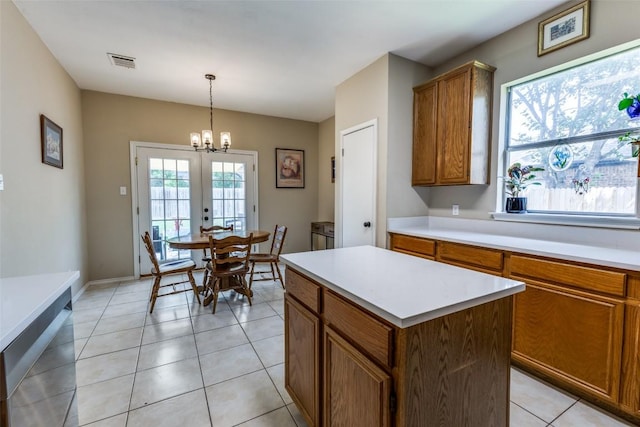 6614 Bramber Ln, Austin, TX 78754 - kitchen with brown cabinets, healthy amount of natural light, and light countertops