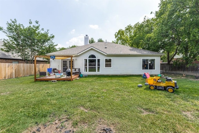 6614 Bramber Ln, Austin, TX 78754 - back of house with a wooden deck and a chimney