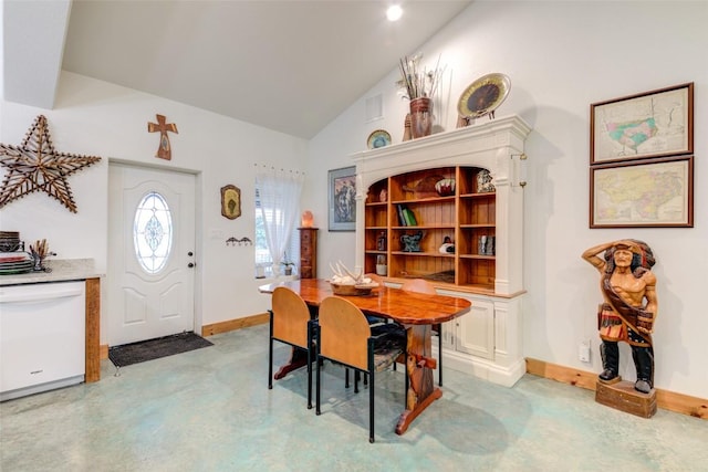 297 White Ranch Rd, Blanco, TX 78606 - dining space with vaulted ceiling, concrete floors, and baseboards