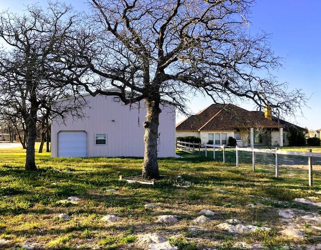 129 S Abrego Xing, Floresville, TX 78114 - view of front of property with fence and a garage