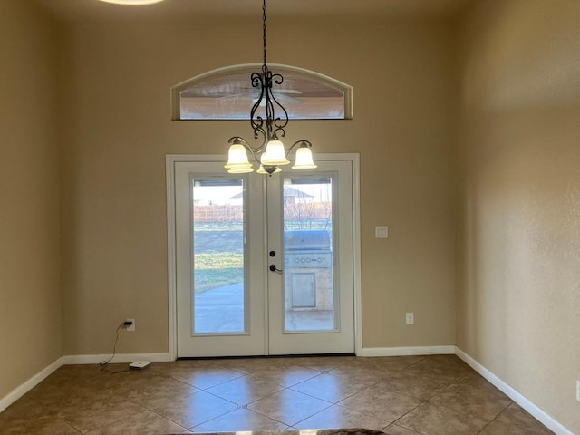 129 S Abrego Xing, Floresville, TX 78114 - doorway featuring a chandelier, tile patterned flooring, baseboards, and french doors