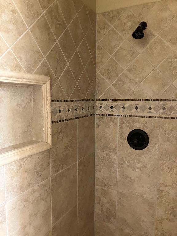 129 S Abrego Xing, Floresville, TX 78114 - bathroom view of a tile shower